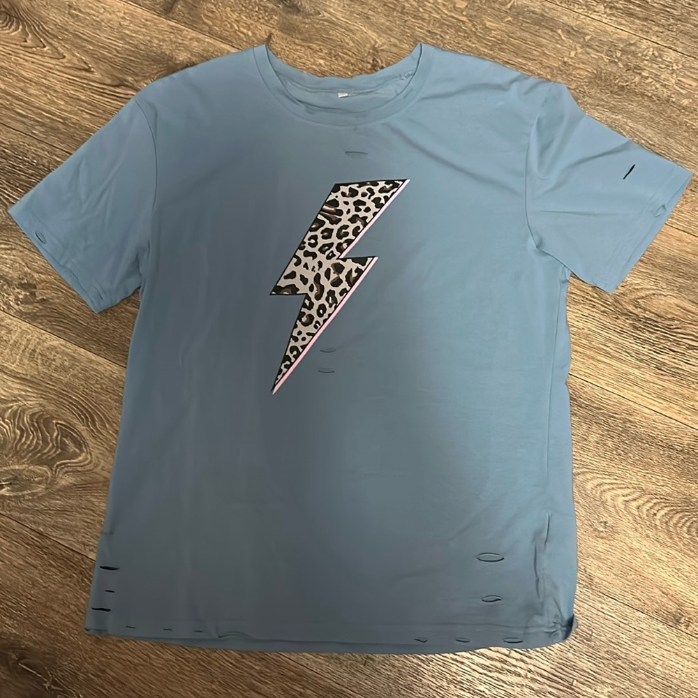 Women’s blue cheetah lightning bolt “distressed” t-shirt. Size L.